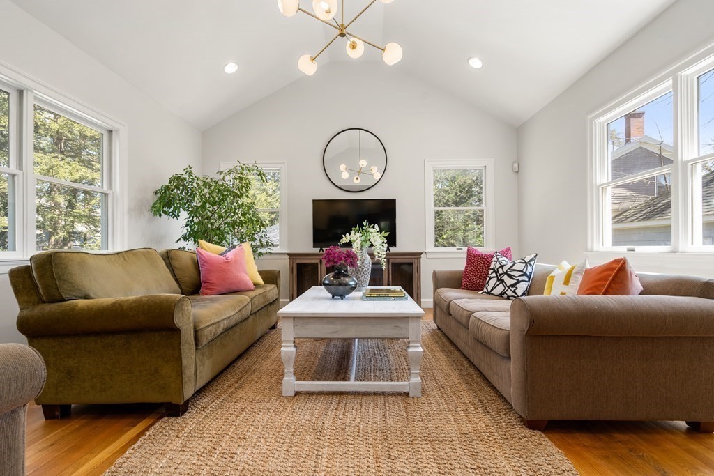 19 Elmore Street Newton, MA 02459 - Photo 5 of 40 a living room with furniture a large window and a clock