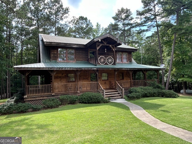 1100 Bartram Trace Road Rayle, GA 30660 - Photo 1 of 1 a view of a house with garden and trees