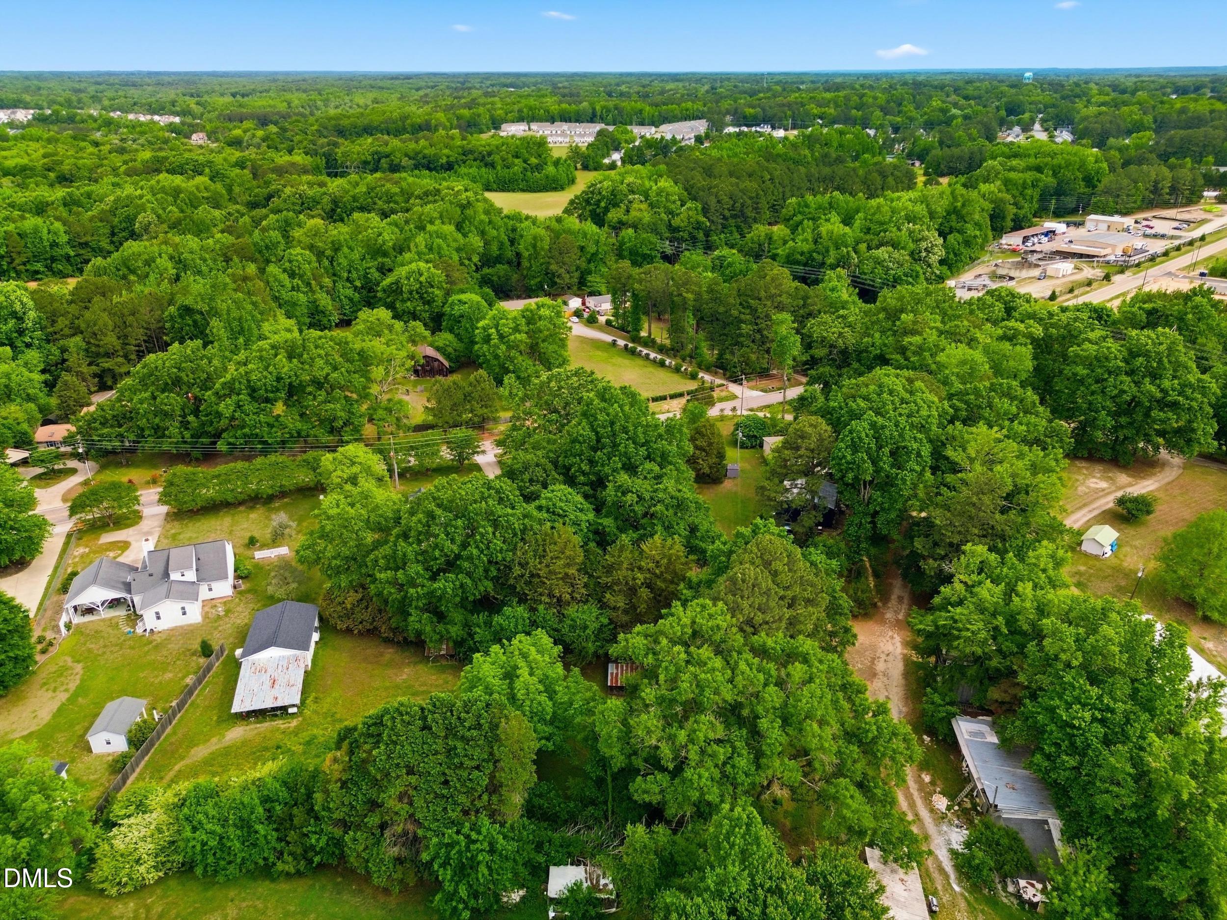 517 Lake Glad Road Wendell, NC 27591 - Photo 35 of 36 an aerial view of residential houses with outdoor space and trees