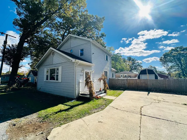 a view of a backyard of the house