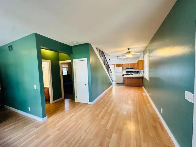 a kitchen with a sink appliances and cabinets