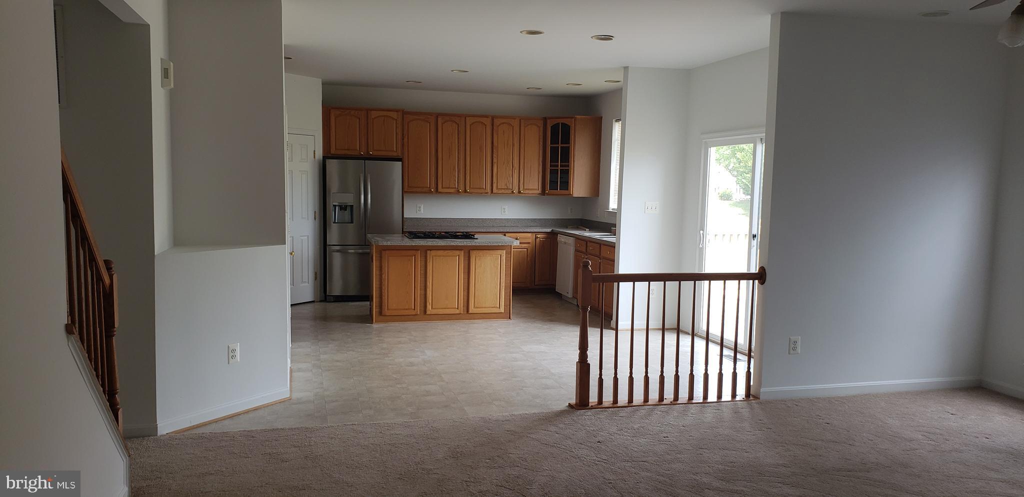 863 Fox Den Road Culpeper, VA 22701 - Photo 19 of 28 a kitchen with granite countertop a refrigerator and a sink