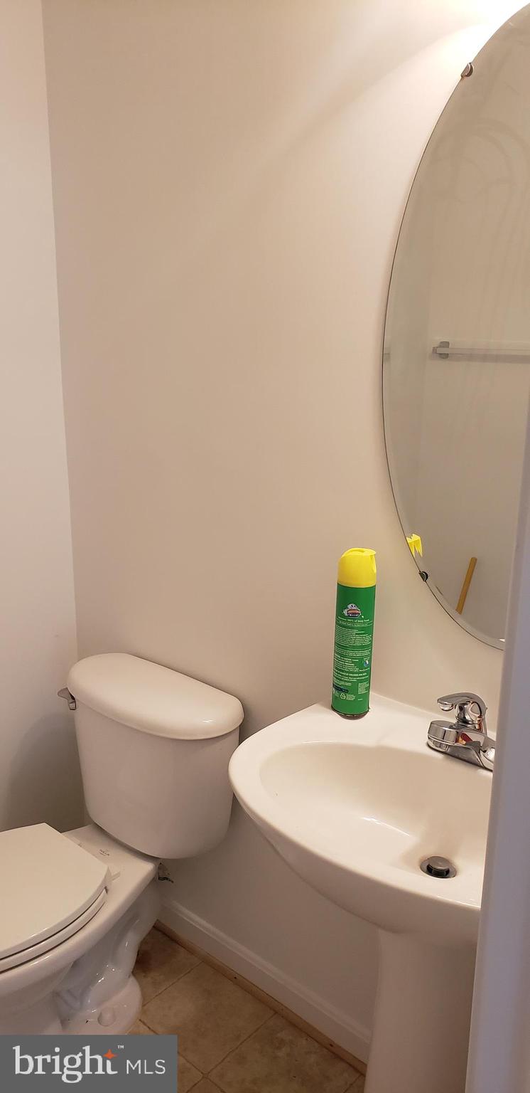 863 Fox Den Road Culpeper, VA 22701 - Photo 20 of 28 a white toilet sitting next to a bathroom sink