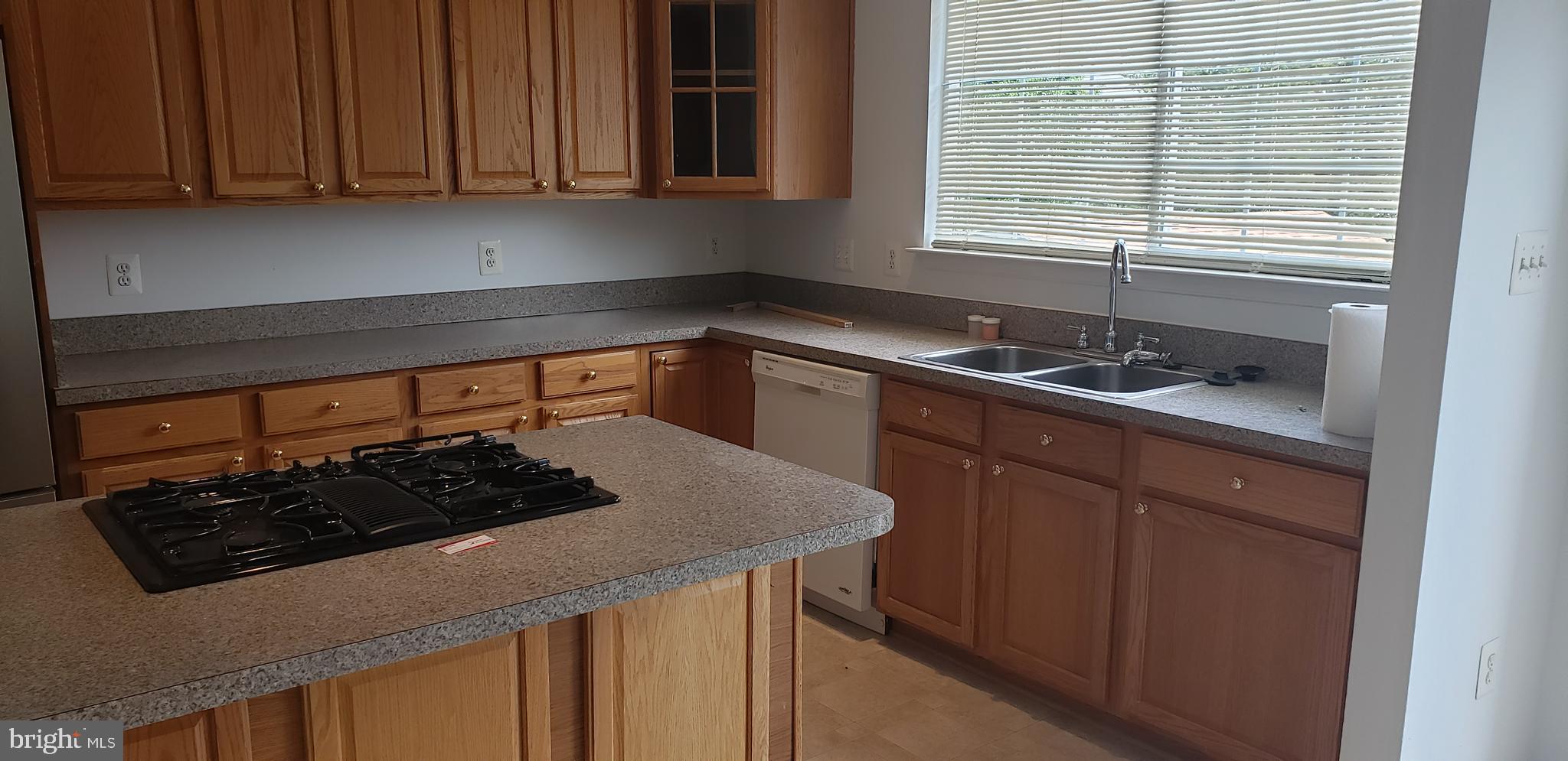 863 Fox Den Road Culpeper, VA 22701 - Photo 25 of 28 a kitchen with stainless steel appliances granite countertop a sink stove and cabinets
