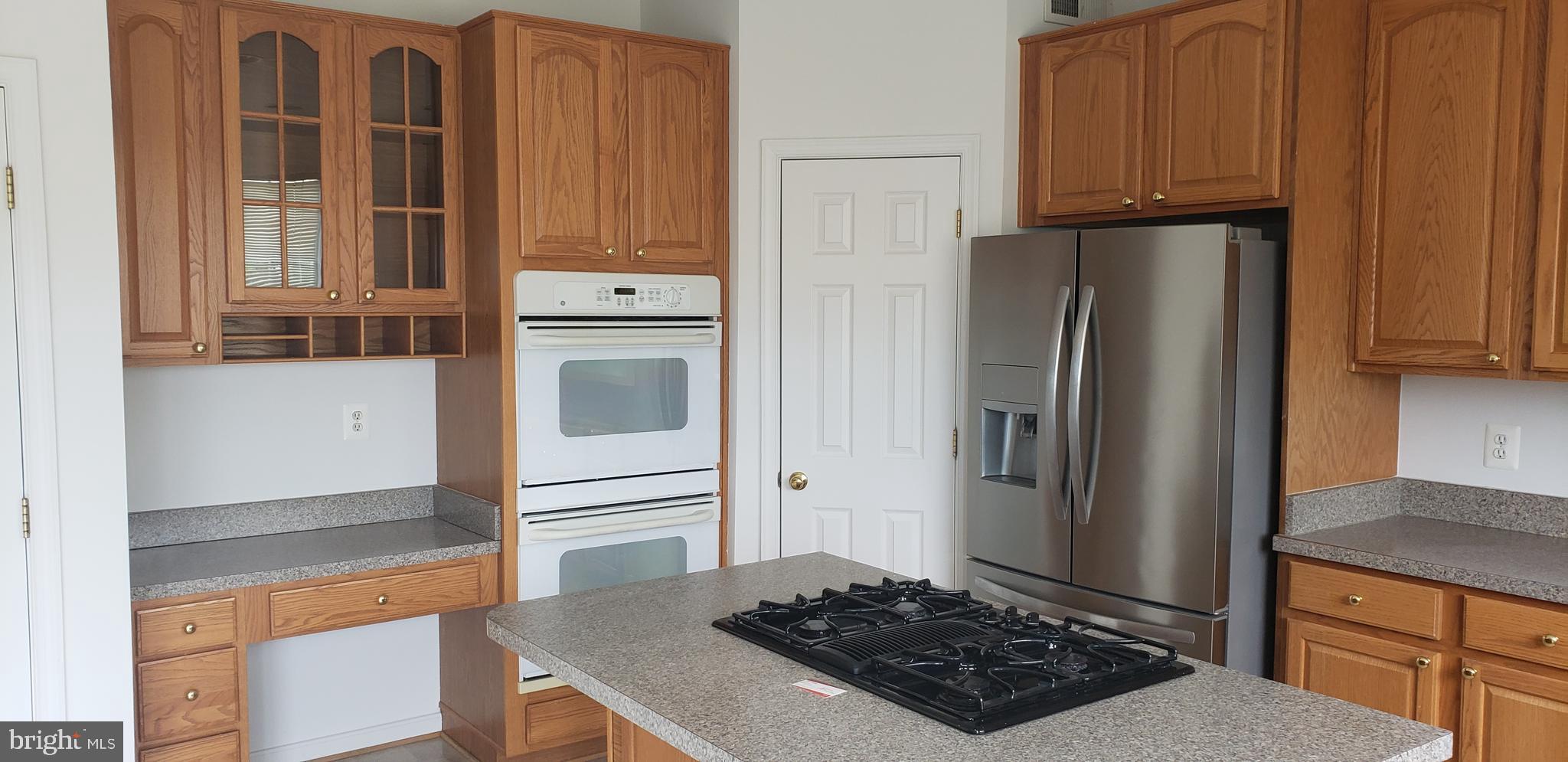 863 Fox Den Road Culpeper, VA 22701 - Photo 26 of 28 a kitchen with stainless steel appliances granite countertop a refrigerator and a stove