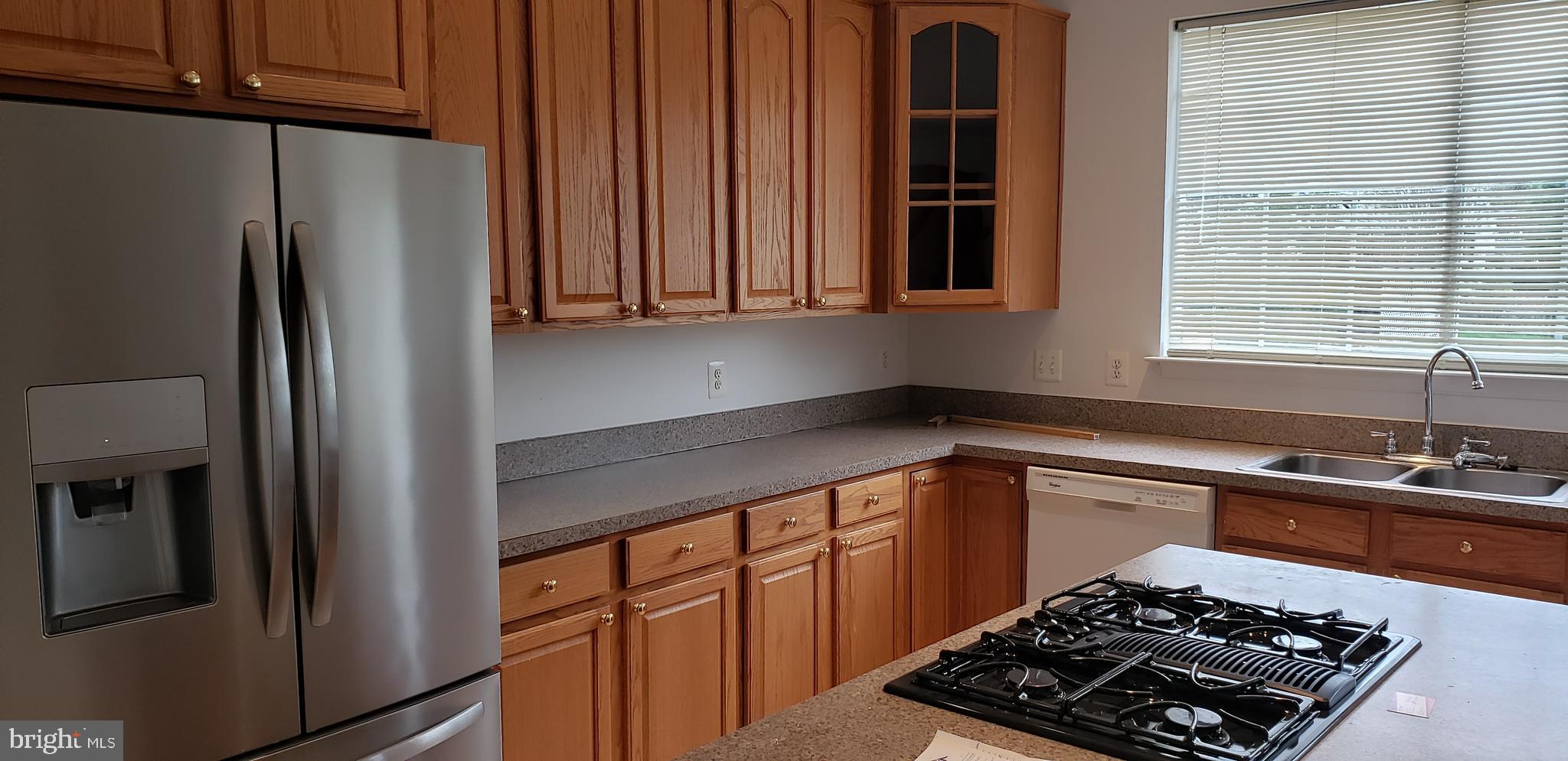863 Fox Den Road Culpeper, VA 22701 - Photo 3 of 28 a kitchen with stainless steel appliances a refrigerator a sink and a stove