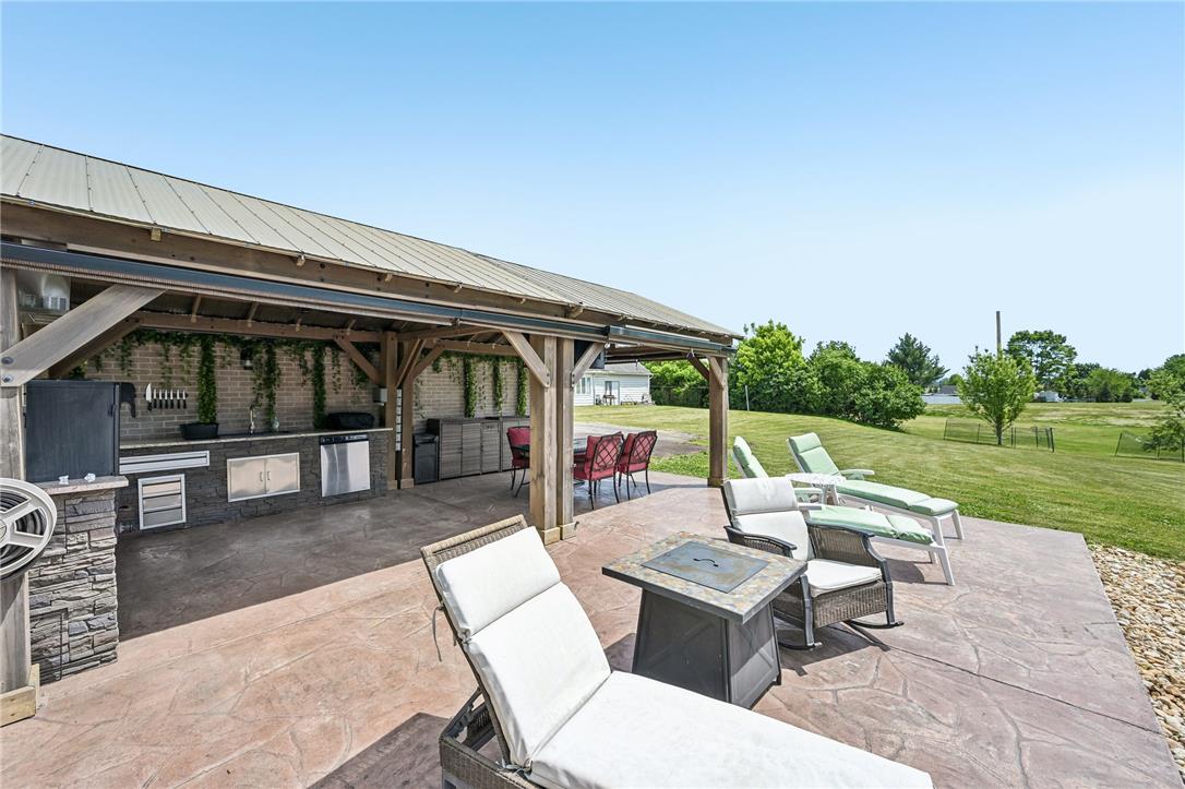 4065 Airport Road Allentown, PA 18109 - Photo 22 of 28 An inviting outdoor kitchen area and spacious patio, perfect for alfresco dining and relaxation.