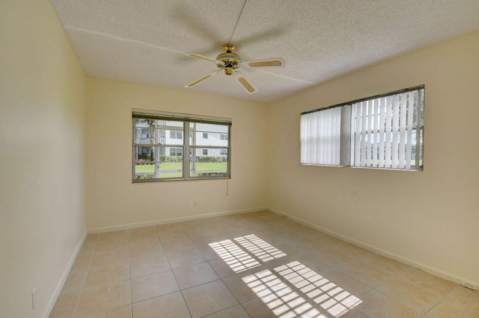 46 Brighton B Boca Raton, FL 33434 - Photo 14 of 50 a view of an empty room with a window