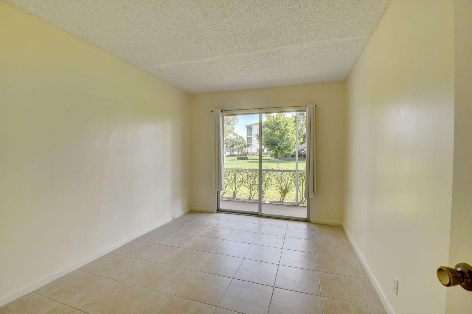 46 Brighton B Boca Raton, FL 33434 - Photo 19 of 50 a view of an empty room with a window
