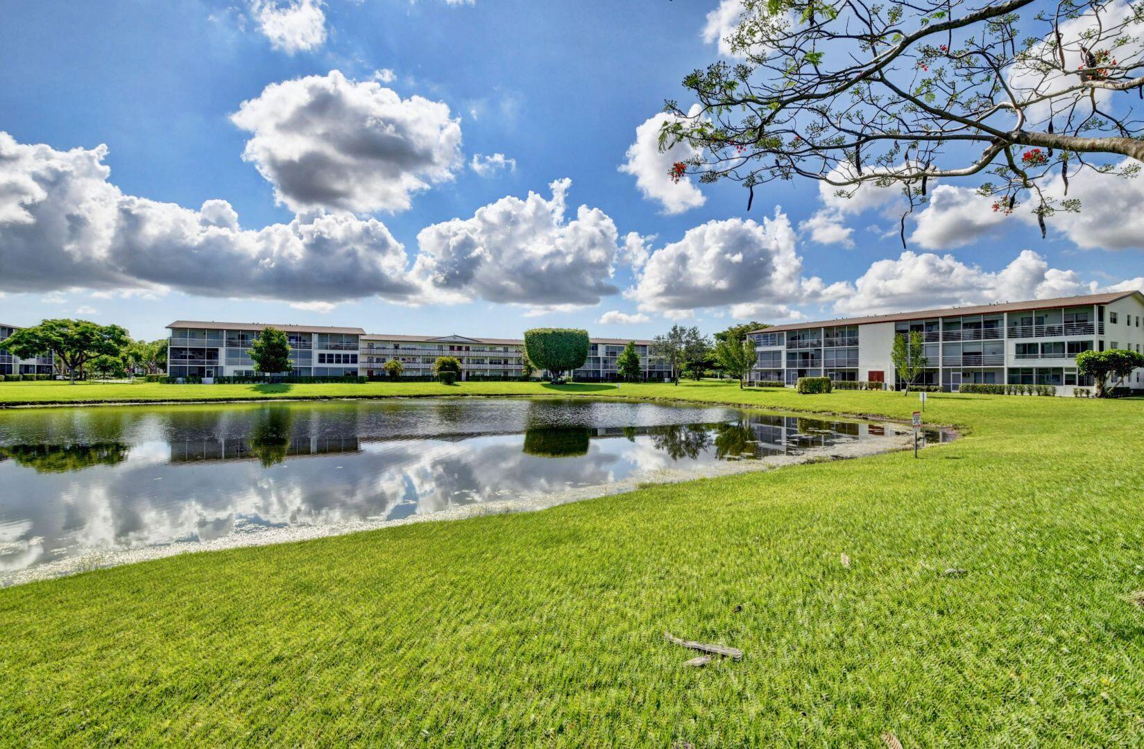 46 Brighton B Boca Raton, FL 33434 - Photo 25 of 50 a view of a lake with a house in the background