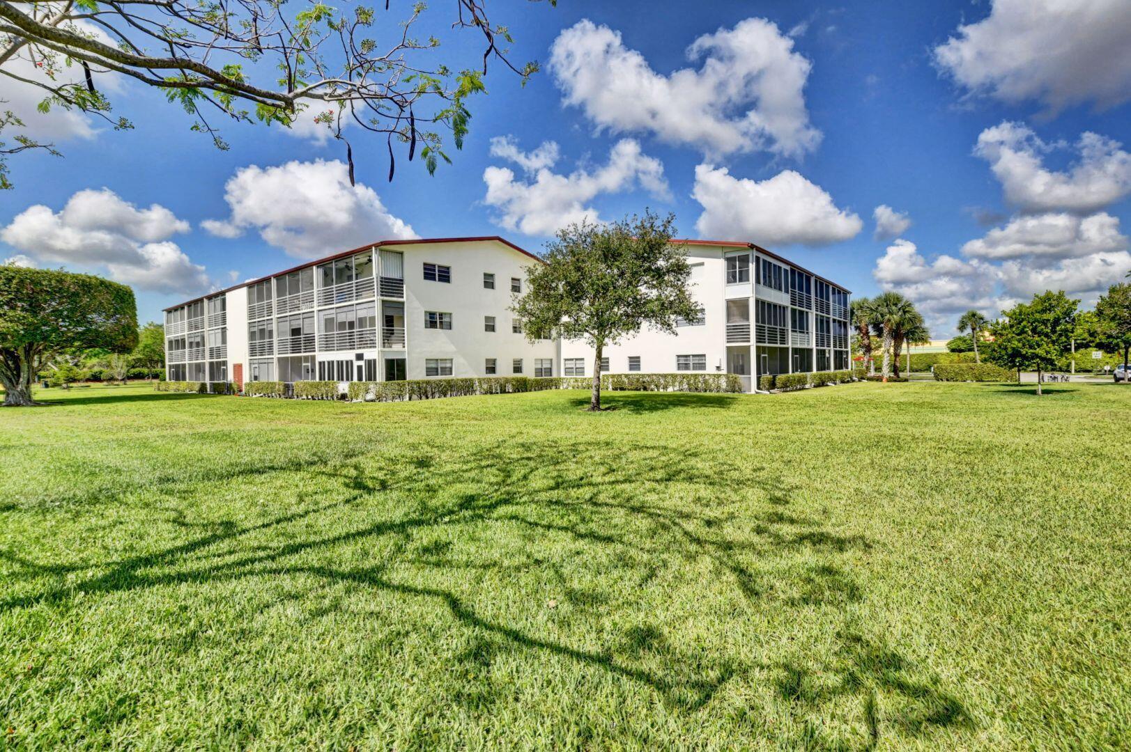 46 Brighton B Boca Raton, FL 33434 - Photo 26 of 50 a view of a building with a big yard
