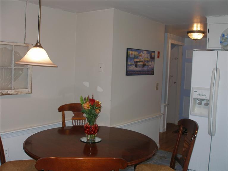 14 Paddock Pond Road Harwich, MA 02645 - Photo 13 of 28 a dining room with furniture and wooden floor