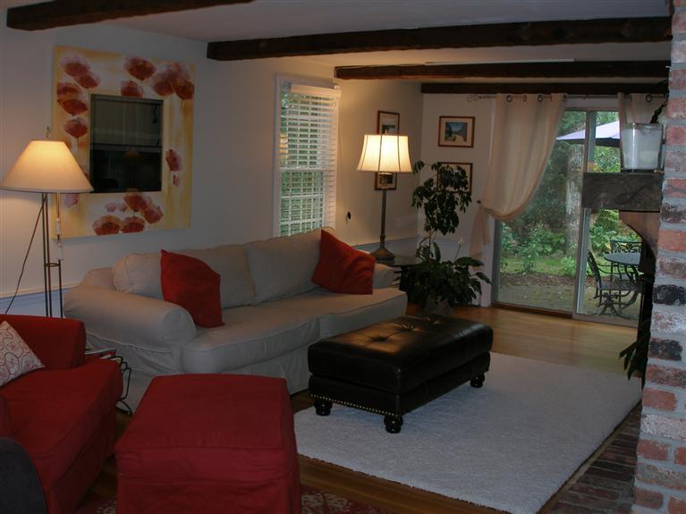 14 Paddock Pond Road Harwich, MA 02645 - Photo 18 of 28 a living room with furniture and a lamp
