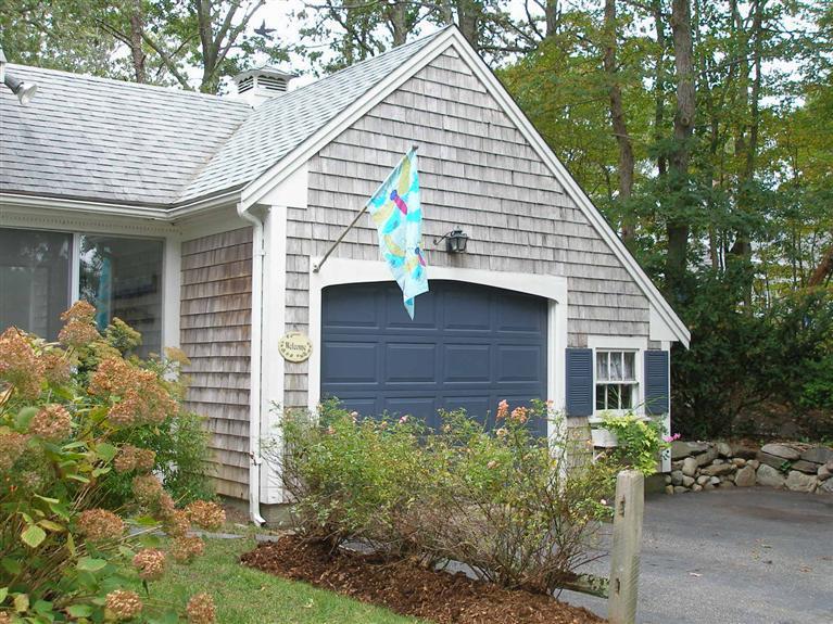14 Paddock Pond Road Harwich, MA 02645 - Photo 2 of 28 a view of a house with brick walls and potted plants