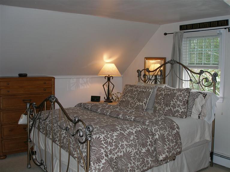 14 Paddock Pond Road Harwich, MA 02645 - Photo 24 of 28 a bed sitting in a bedroom next to a window