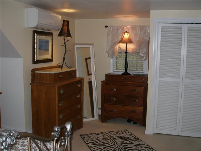 14 Paddock Pond Road Harwich, MA 02645 - Photo 25 of 28 a bedroom with a bed and a dresser