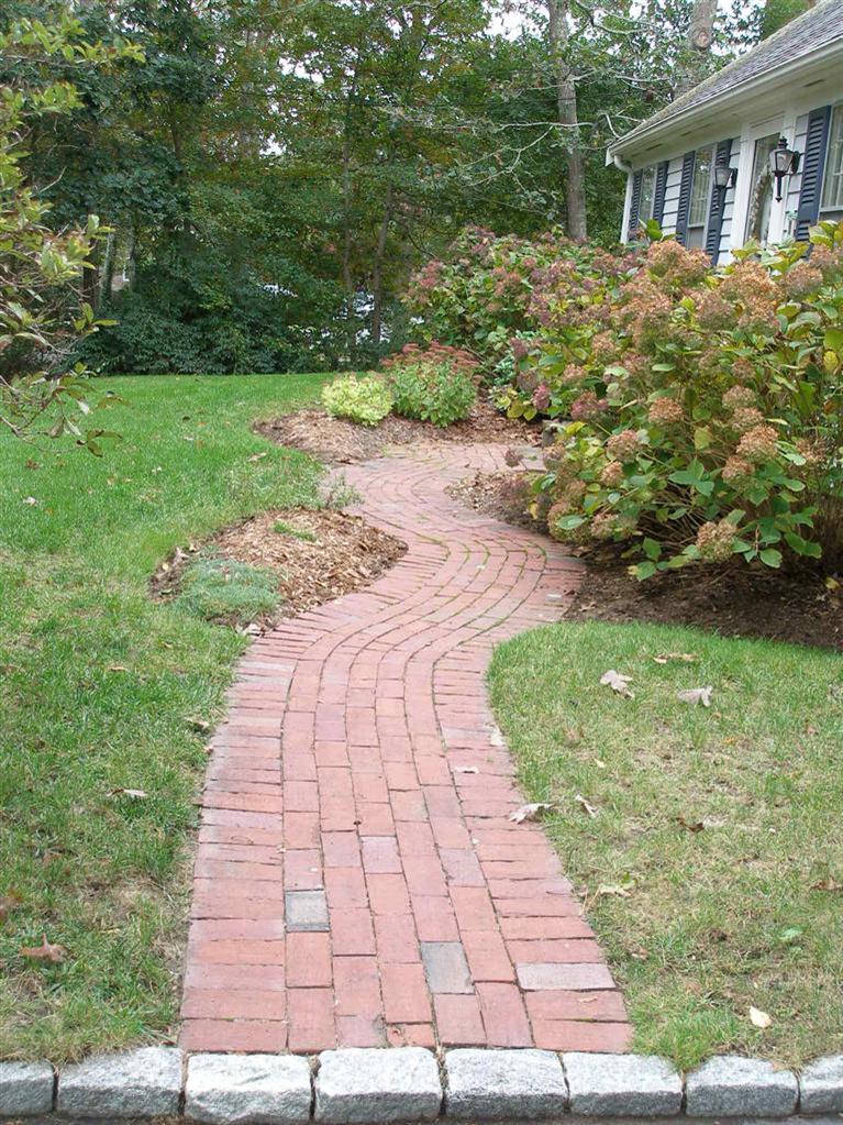 14 Paddock Pond Road Harwich, MA 02645 - Photo 4 of 28 a pathway of a house with a yard
