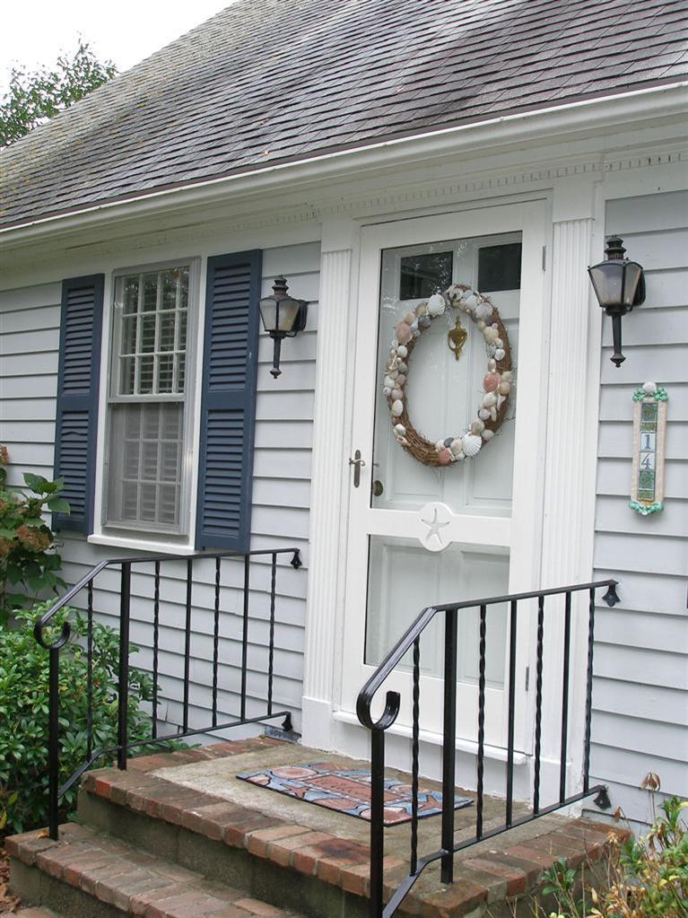 14 Paddock Pond Road Harwich, MA 02645 - Photo 5 of 28 a view of a house with a wooden fence