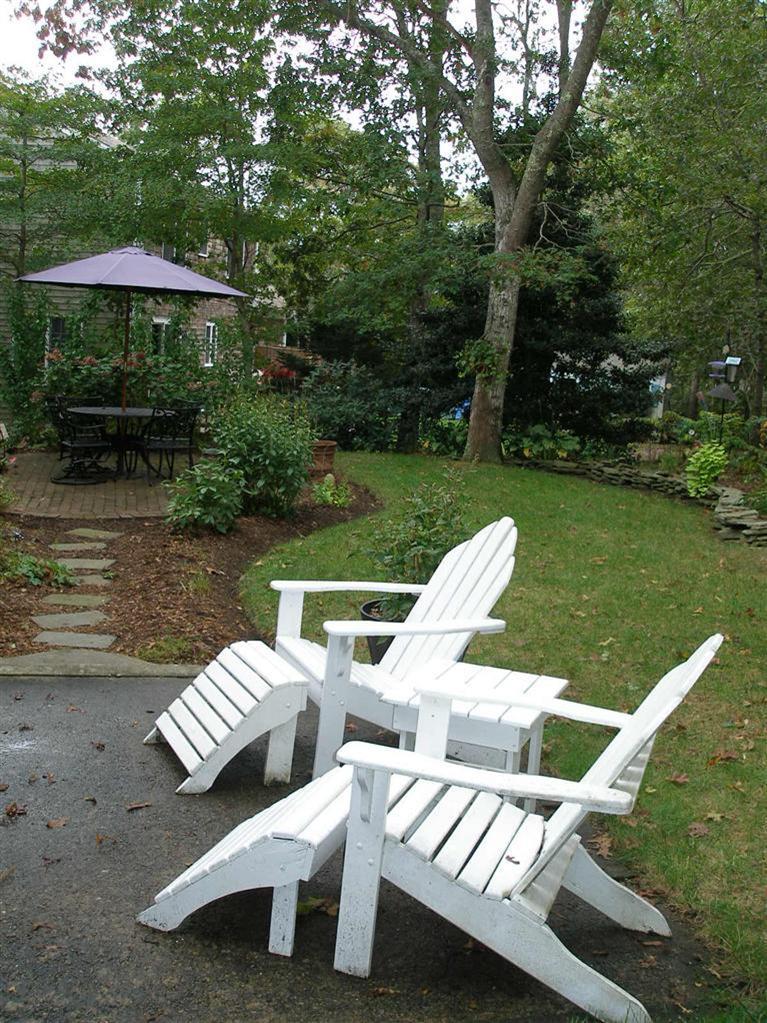 14 Paddock Pond Road Harwich, MA 02645 - Photo 9 of 28 a view of a patio with chairs and a table