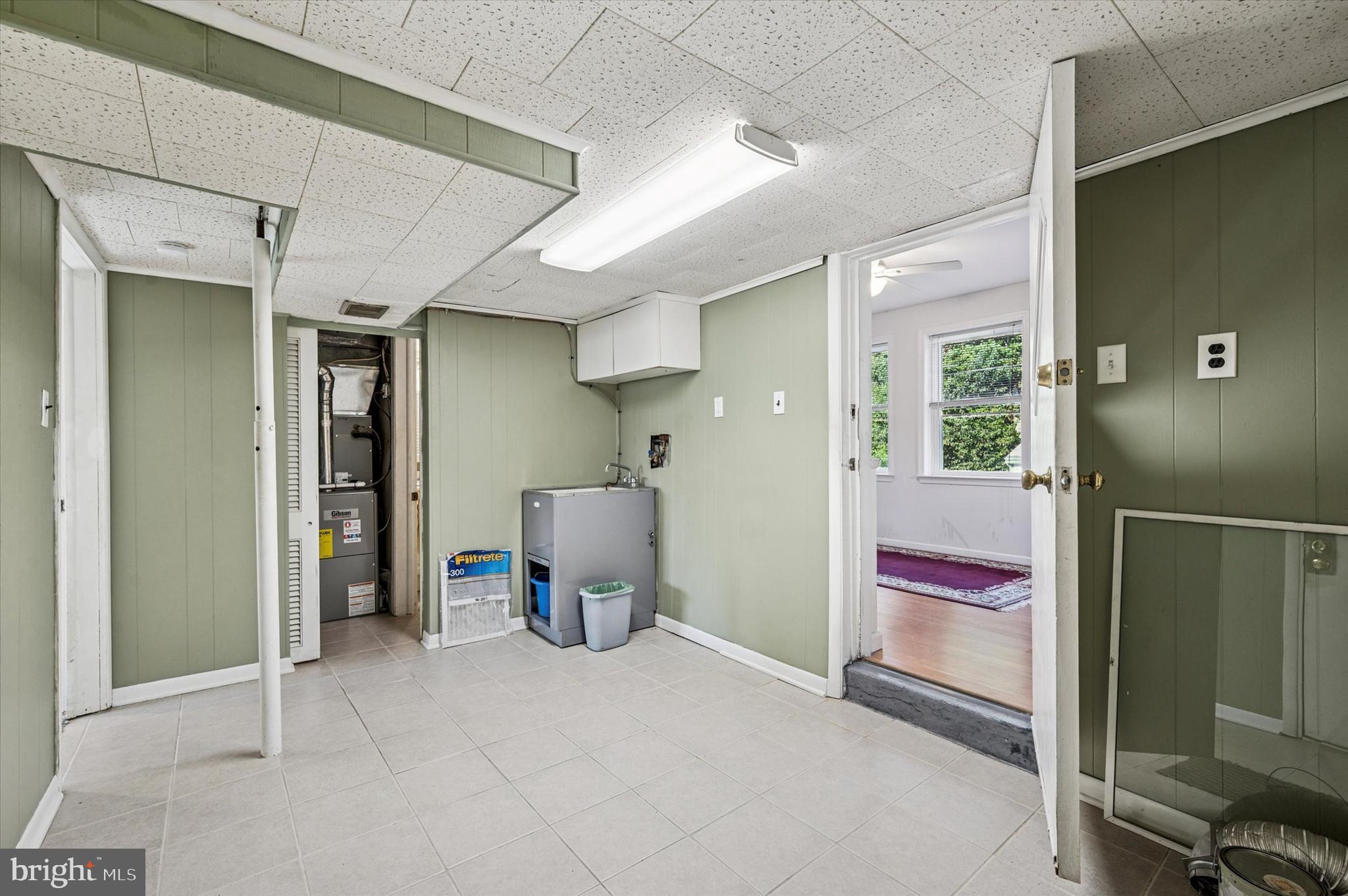 708 Cambridge Road Brookhaven, PA 19015 - Photo 14 of 20 a view of kitchen with a sink and a refrigerator
