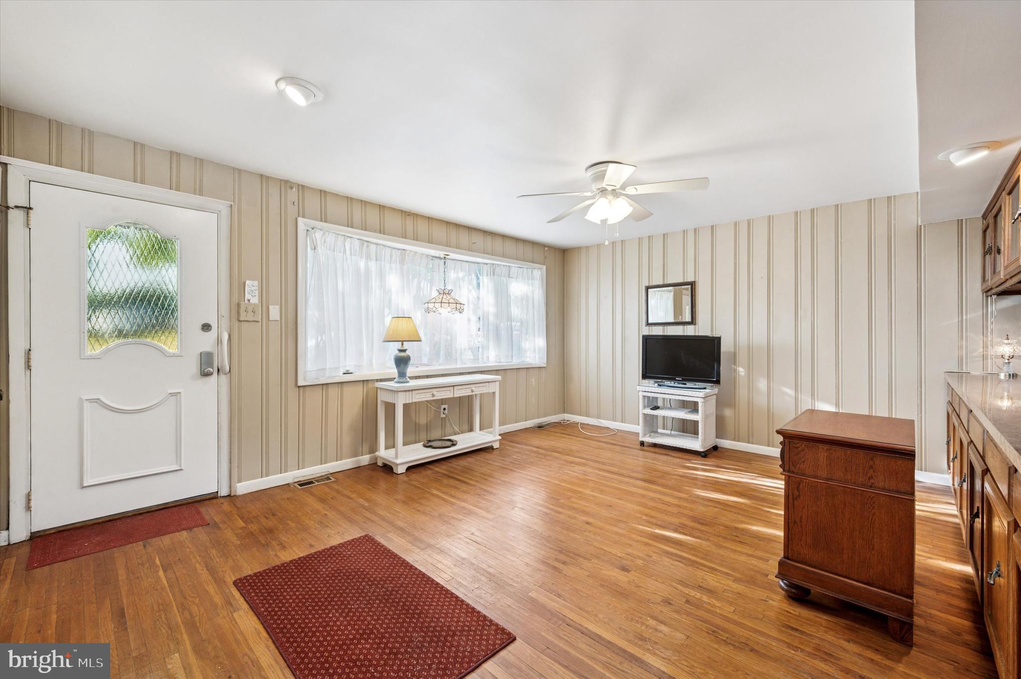 708 Cambridge Road Brookhaven, PA 19015 - Photo 3 of 20 a living room with furniture and a flat screen tv