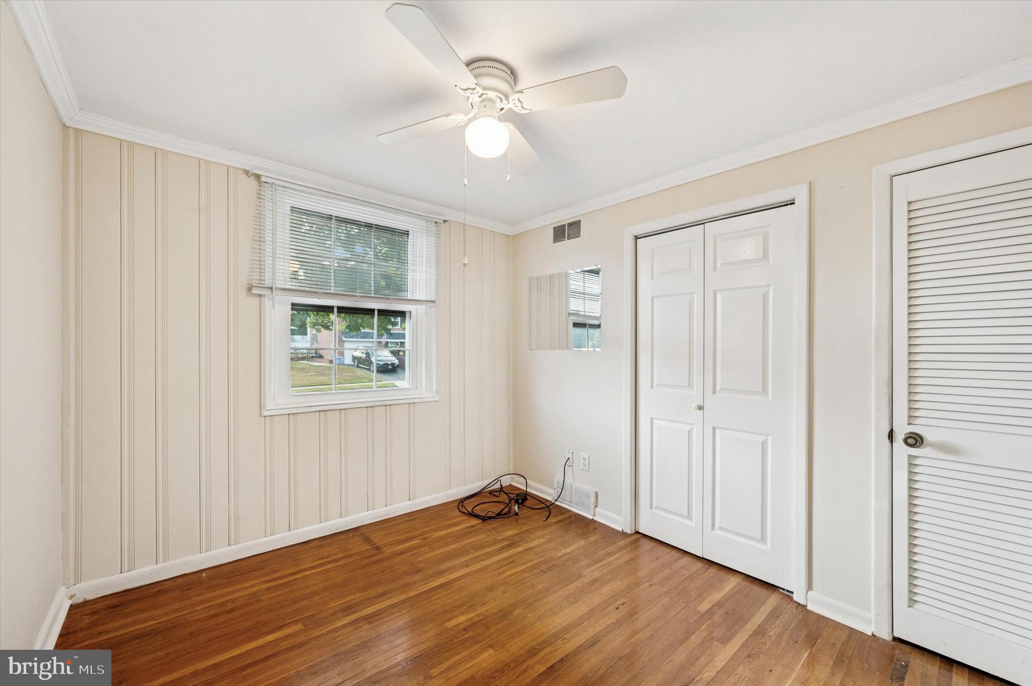 708 Cambridge Road Brookhaven, PA 19015 - Photo 9 of 20 wooden floor in an empty room with a window