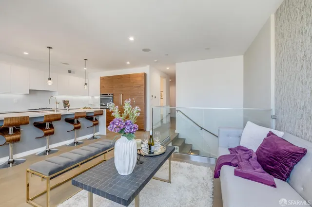 a kitchen with stainless steel appliances granite countertop a sink and cabinets