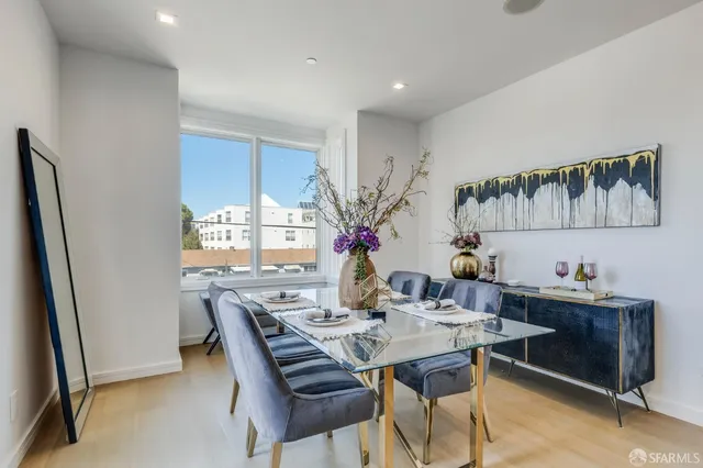 a view of a dining room with furniture and window