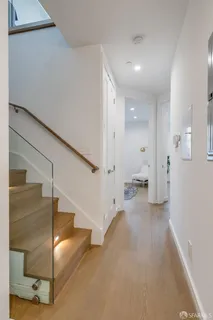 a view of a hallway with staircase