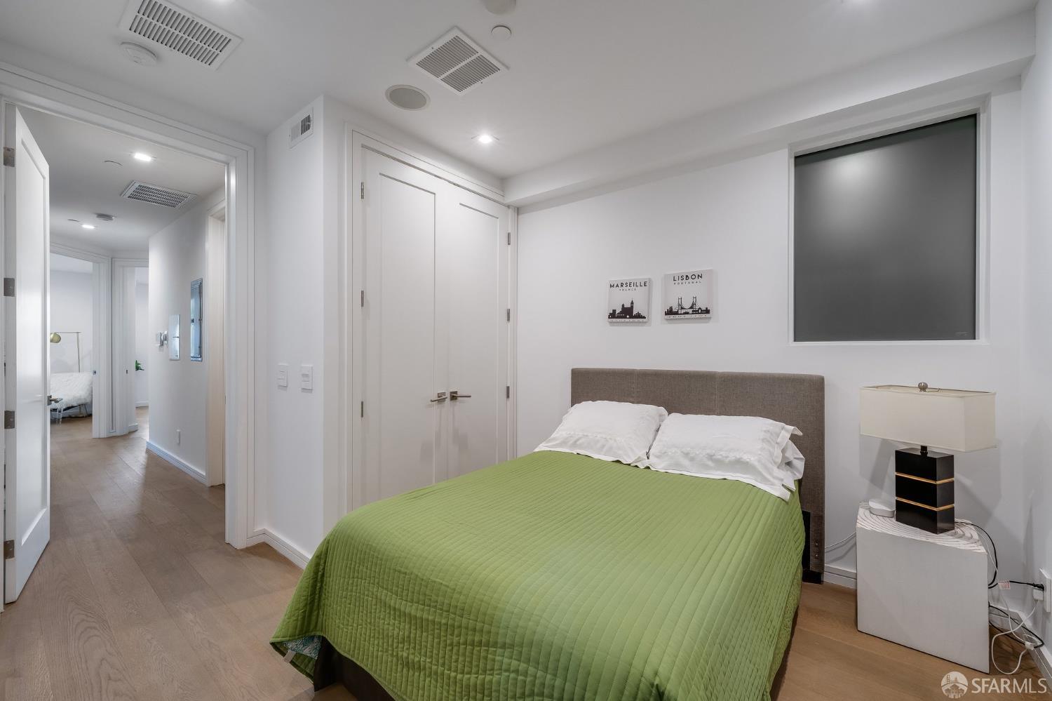 2829 25th Street, Unit 3 San Francisco, CA 94110 - Photo 24 of 36 a bedroom with a bed and a flat screen tv