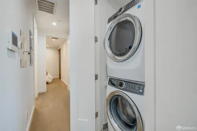 a view of a hallway with washer and dryer