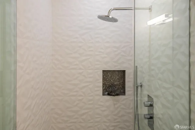 a bathroom with a shower and a sink