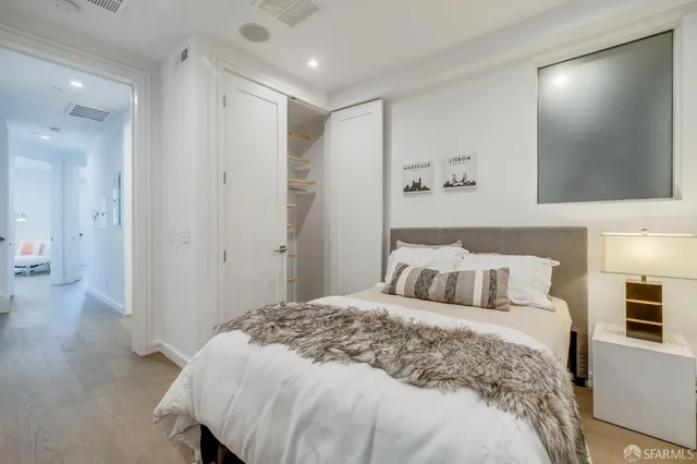 a bedroom with a bed and a view of bathroom