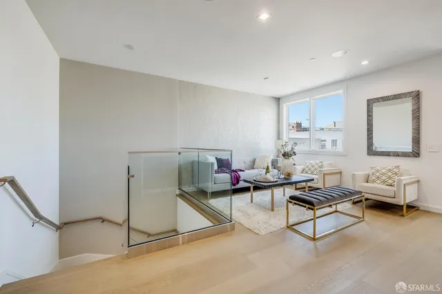 a living room with furniture and a table