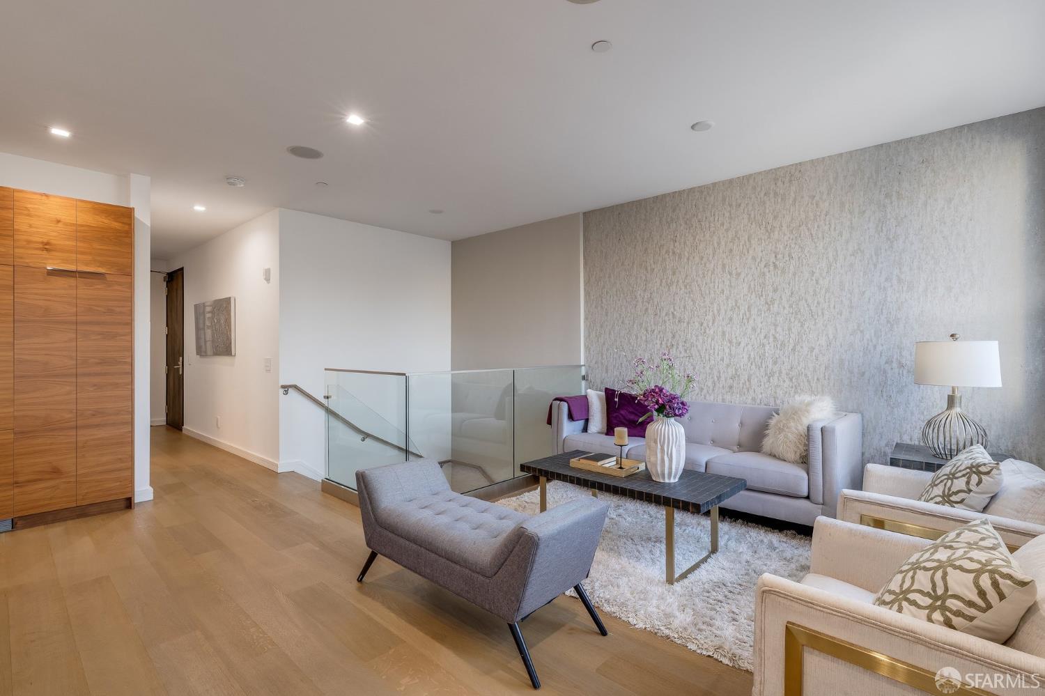 2829 25th Street, Unit 3 San Francisco, CA 94110 - Photo 9 of 36 a living room with furniture and a wooden floor
