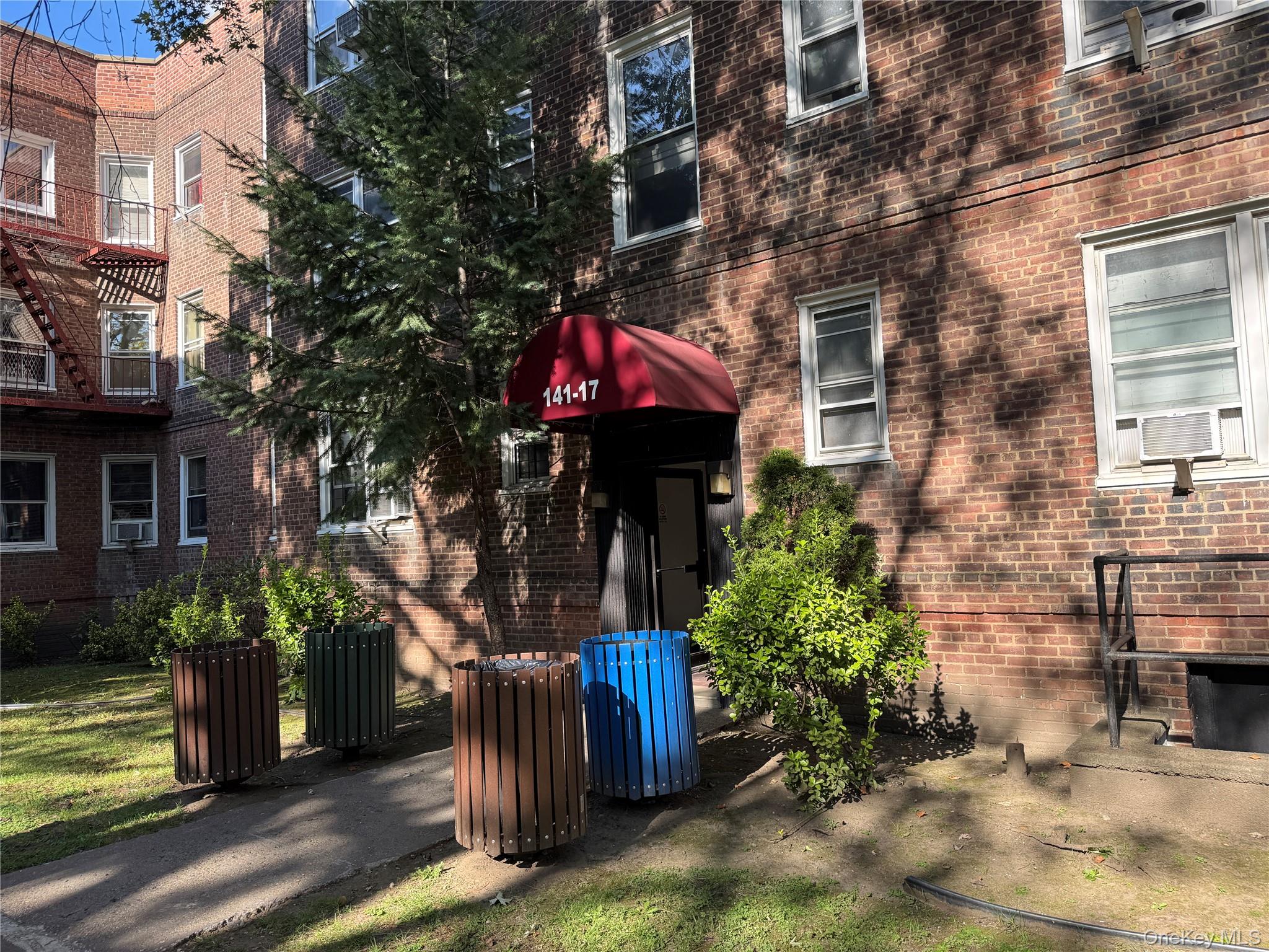 View of exterior entry featuring brick siding