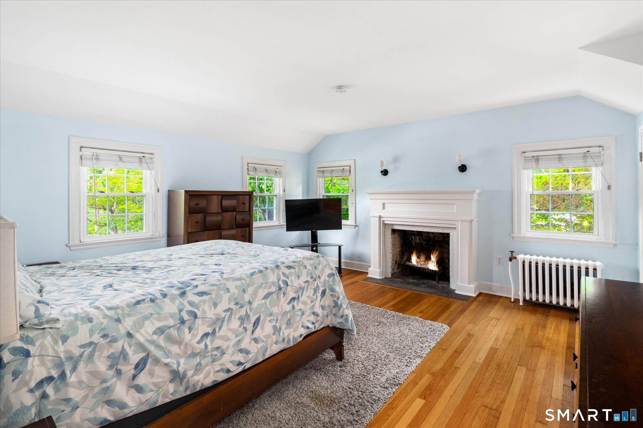 250 High Ridge Road Stamford, CT 06905 - Photo 11 of 22 The beautiful and spacious master bedroom has a beautiful fireplace flanked by sconces and a closet the size of a small bedroom. Professional closet organizer to be installed next week!