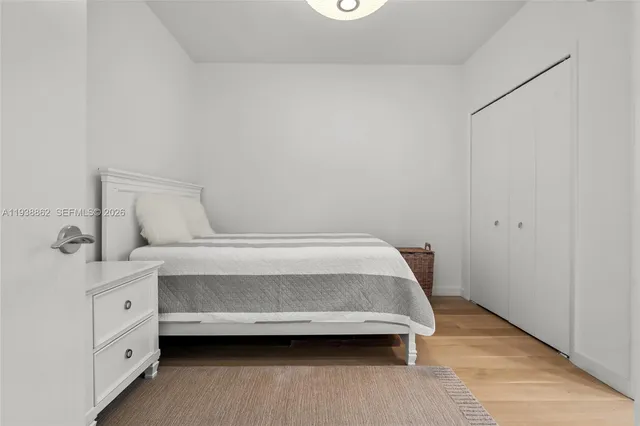 a room with a bed and a night stand