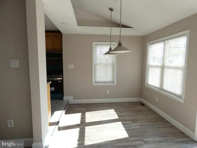 a bathroom with a granite countertop shower and a sink