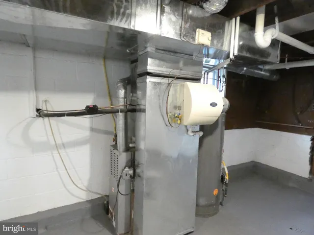 a view of a yard with a house and large trees