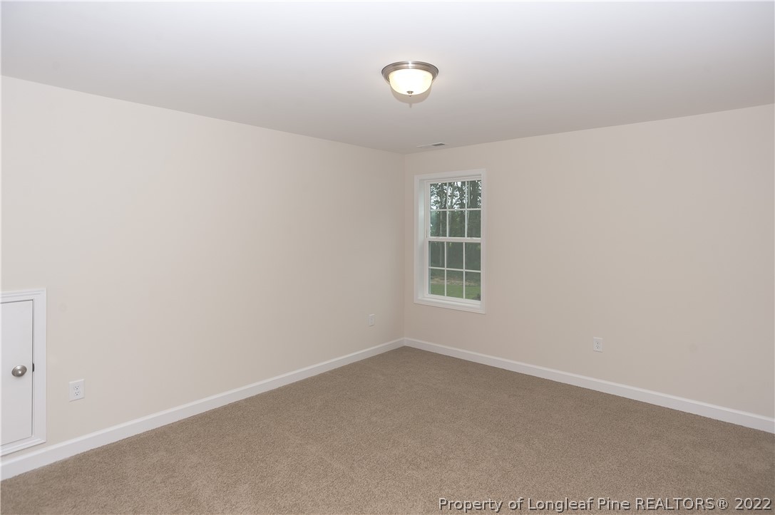 312 Mill Ridge Court Godwin, NC 28344 - Photo 24 of 32 an empty room with windows