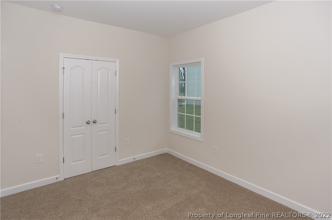 312 Mill Ridge Court Godwin, NC 28344 - Photo 27 of 32 an empty room with windows