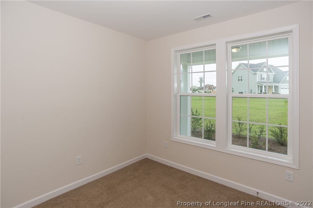 312 Mill Ridge Court Godwin, NC 28344 - Photo 4 of 32 an empty room with a window