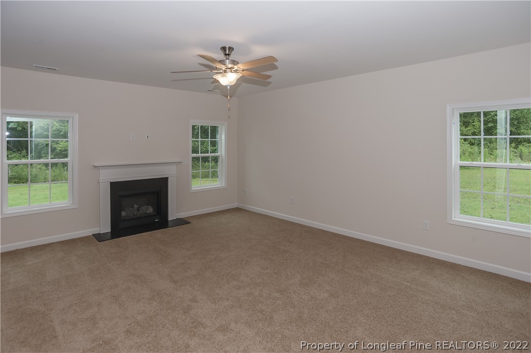 312 Mill Ridge Court Godwin, NC 28344 - Photo 5 of 32 a view of empty room with window