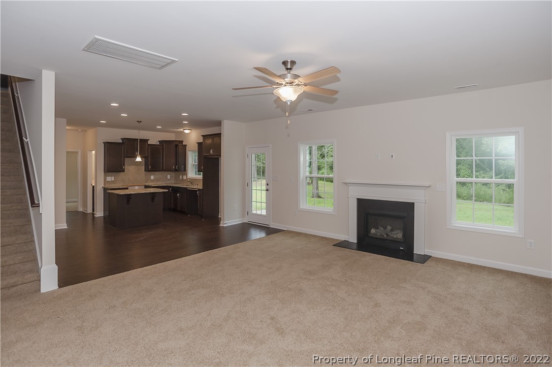 312 Mill Ridge Court Godwin, NC 28344 - Photo 6 of 32 a view of a livingroom with a fireplace and window