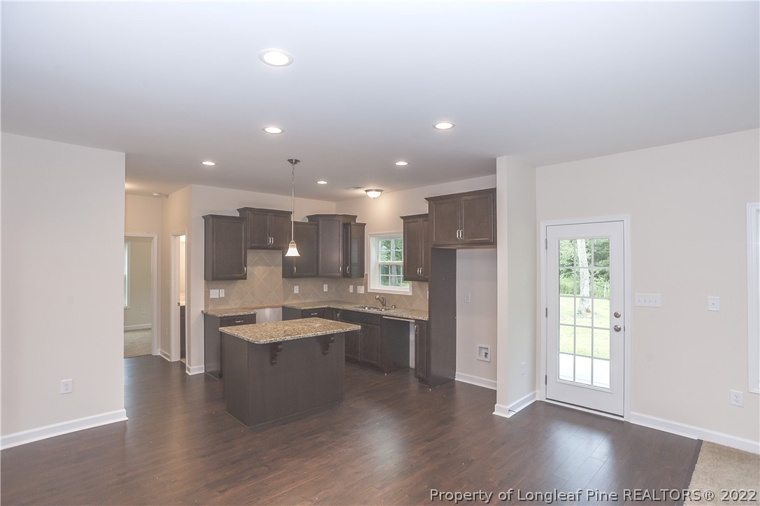 312 Mill Ridge Court Godwin, NC 28344 - Photo 10 of 32 a large kitchen with a large window and stainless steel appliances