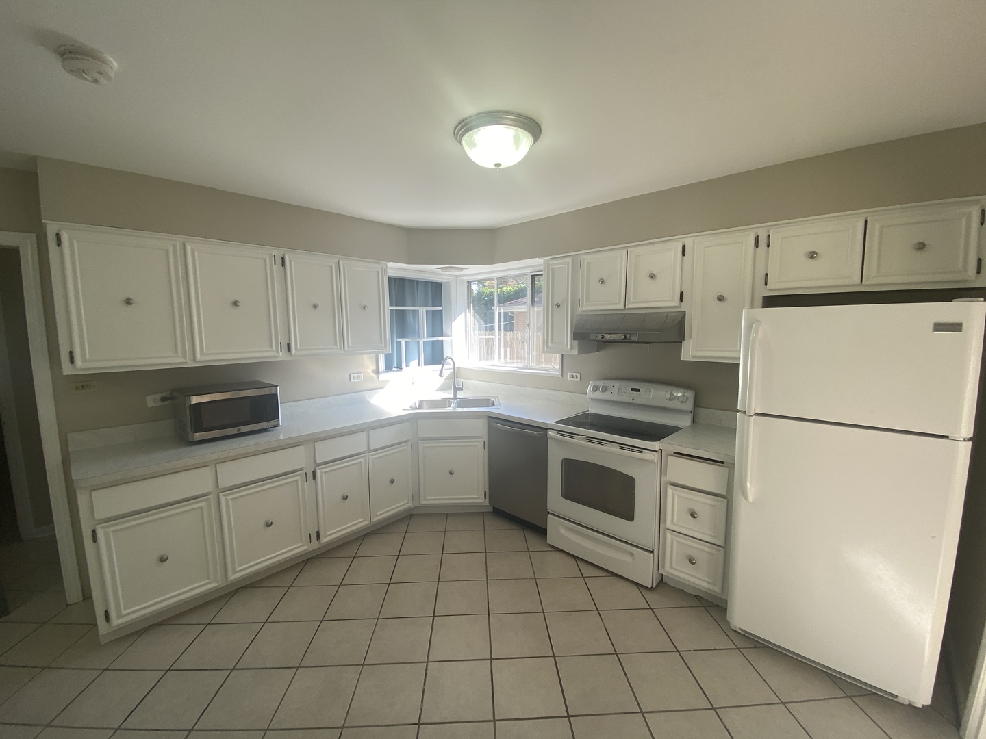 1025 South Dee Road Park Ridge, IL 60068 - Photo 12 of 13 a kitchen with a stove sink and refrigerator