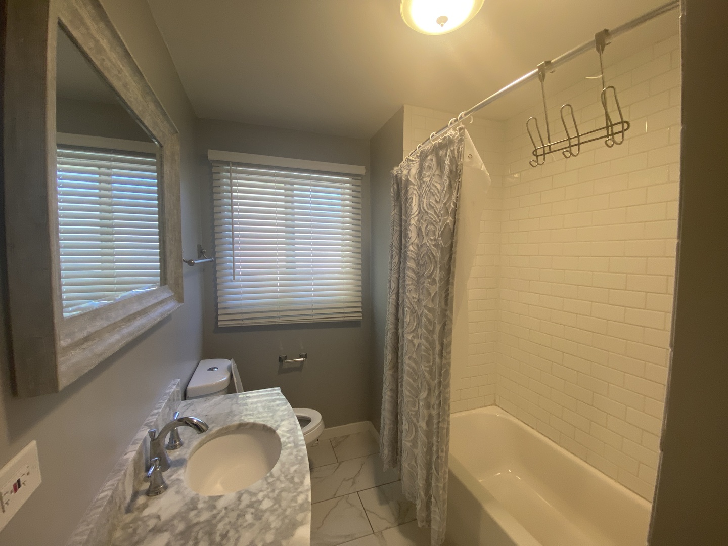 1025 South Dee Road Park Ridge, IL 60068 - Photo 6 of 13 a bathroom with a granite countertop sink toilet and shower