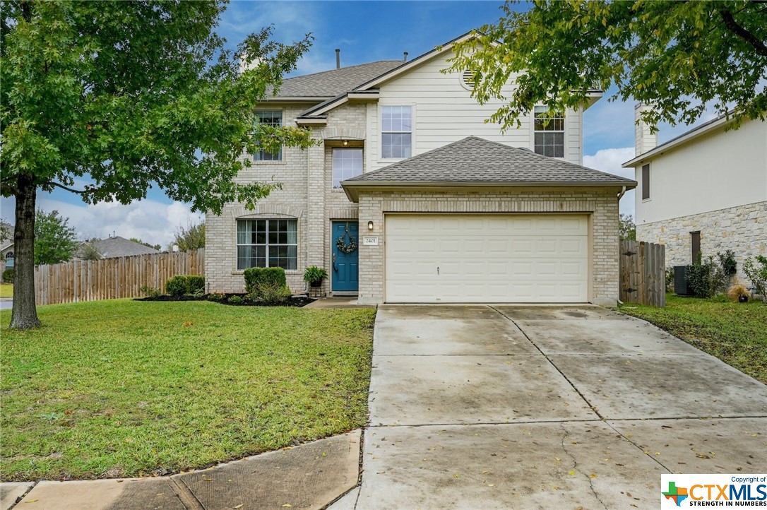 2401 Edgecliff Path Georgetown, TX 78626 - Photo 1 of 1 a front view of a house with a yard and garage