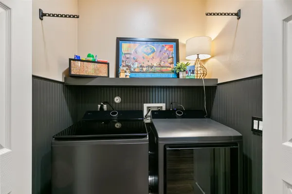 a kitchen with stainless steel appliances a sink and a refrigerator